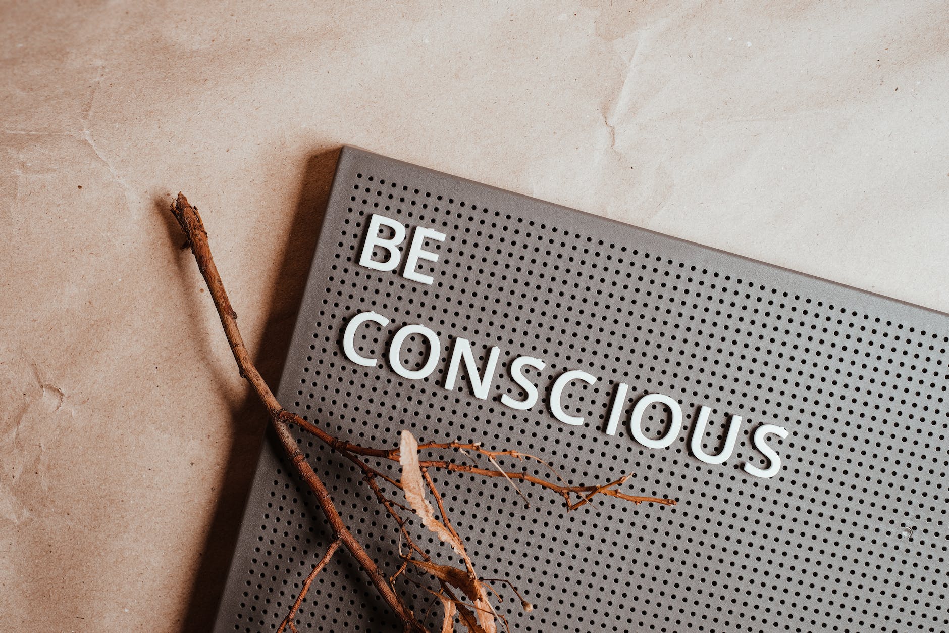 the phrase be conscious on a pin board